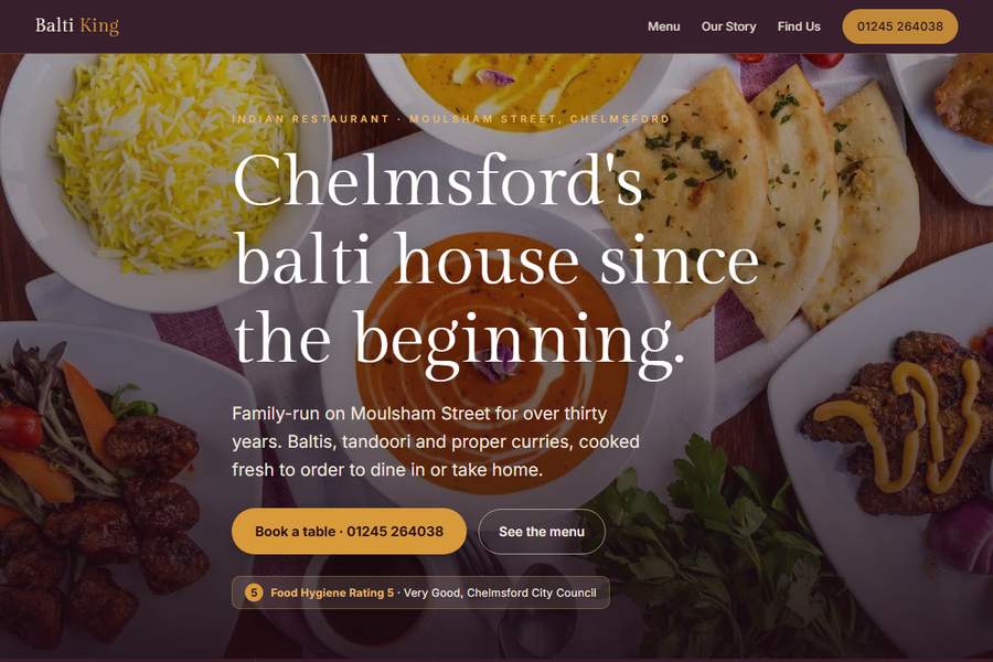 Homepage of the Balti King site, showing the menu, the half price offer and a call button.